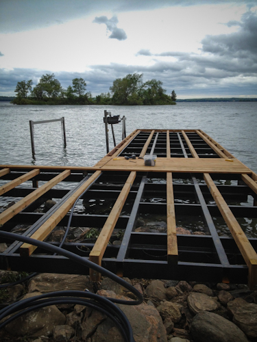 Wood Being Installed on Permanent Dock on Island